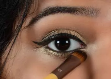 Step 10 of gold eye makeup
