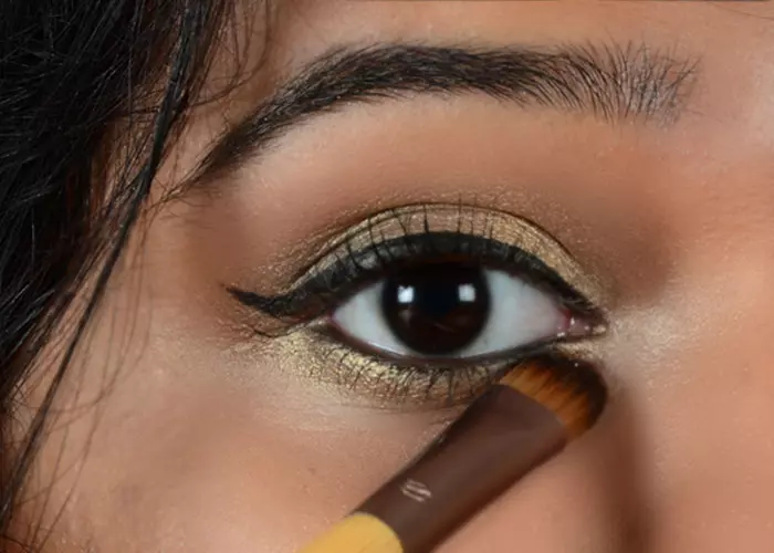 Step 10 of gold eye makeup