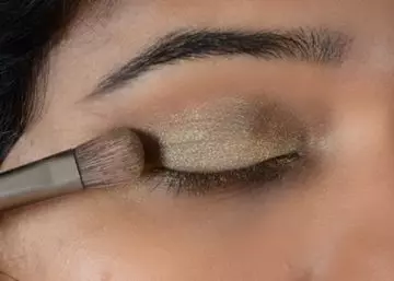 Step 3 of gold eye makeup
