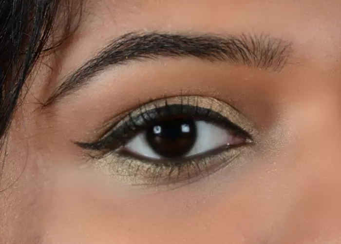 Step 9 of gold eye makeup