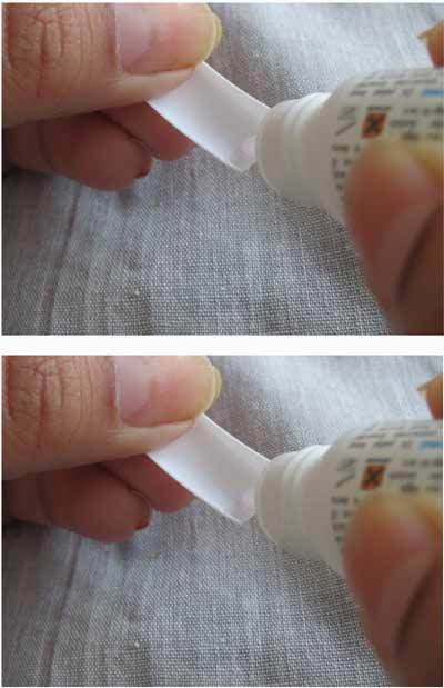 Applying glue on the nail tips
