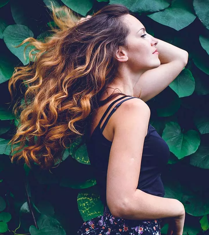 A Women Using A Diffuser To Dry Curly Hair