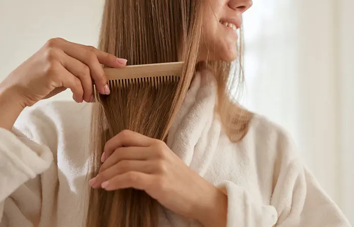 A woman combing her long hair