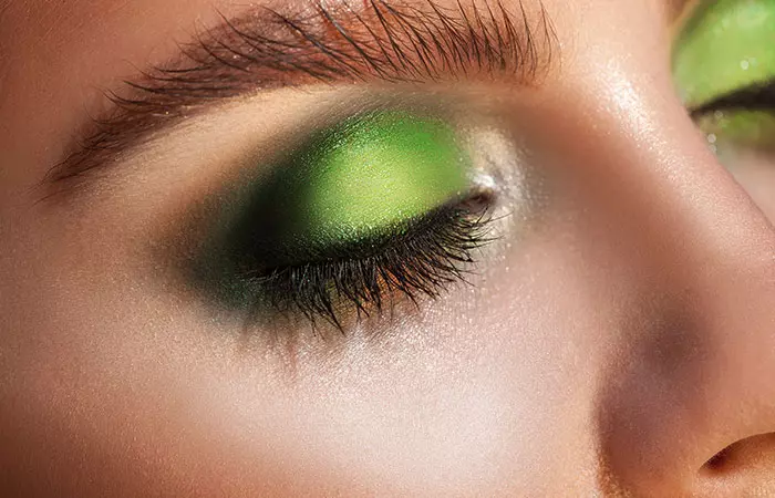 Close up of smokey neon green eye makeup