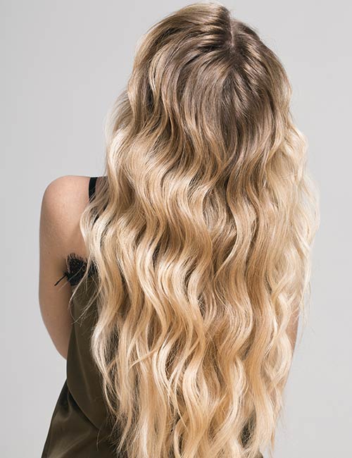 Highlighted beach waves hairstyle for long hair