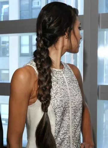 Long side braided hairstyle for frizzy wavy hair