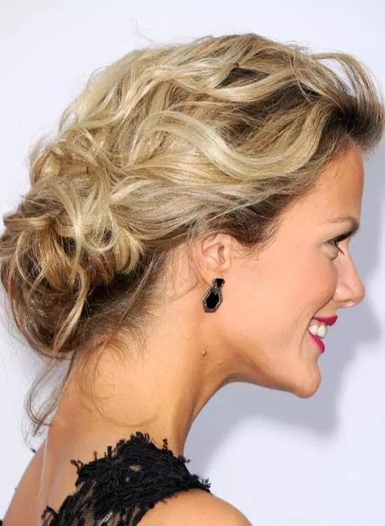 Messy low chignon hairstyle for triangle face shape