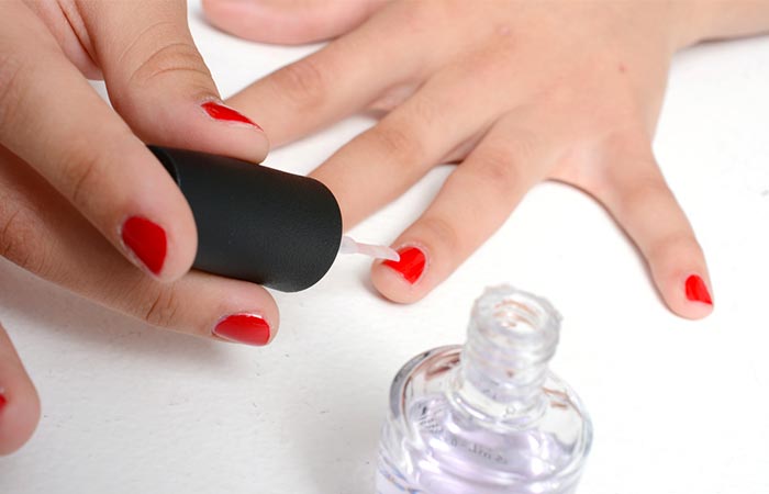 Finish the home manicure process by applying a clear nail polish