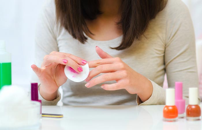 Remove any traces of nail polish as part of the manicure