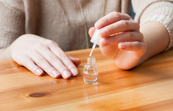 Apply a thin base coat on manicured polished nails