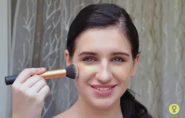 Blend the cream foundation using a makeup brush