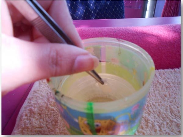 Use tweezers and water to apply full nail water decals