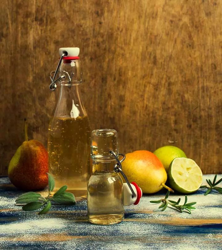 Vinegar bottle with some fruits