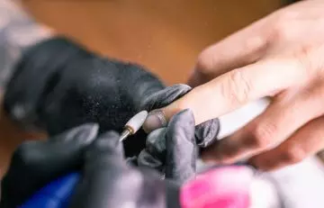 Remove acrylic nails with an electric nail bit
