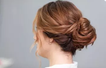 Messy low side bun hairstyle 