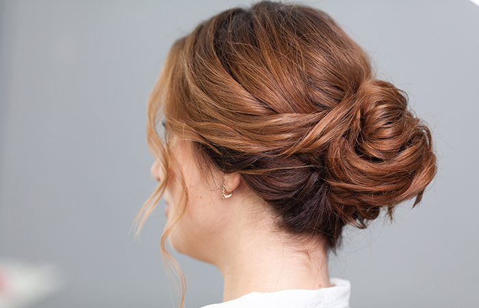 Messy low side bun hairstyle 