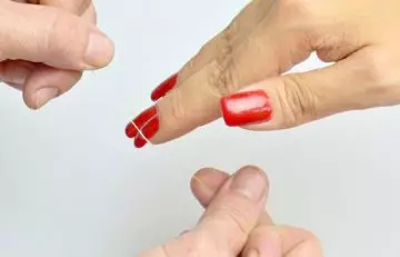 Remove acrylic nails using dental floss