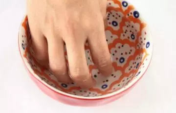 Remove acrylic nails using warm water