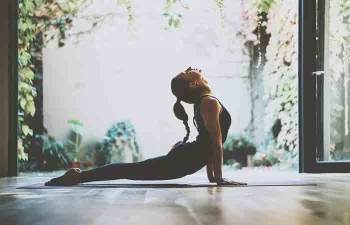 Woman practicing yoga for stress and anger relief