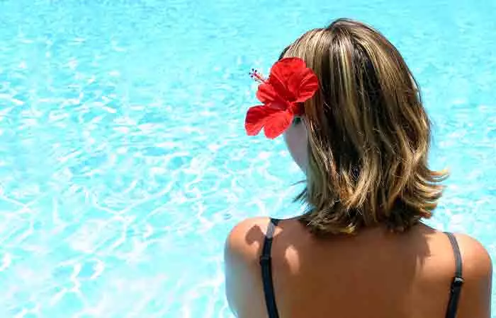 Woman with Chinese hibiscus in her hair