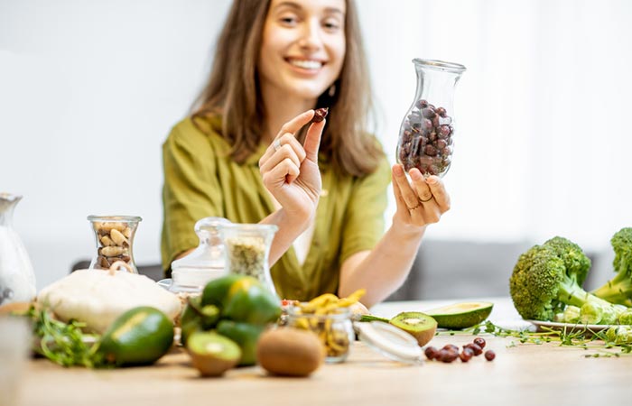 Woman eating dried rosehips for better health