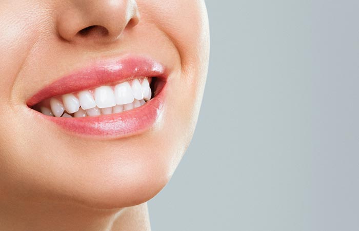 Woman with healthy teeth after using neem