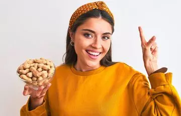 Woman recommending peanuts for their many health benefits