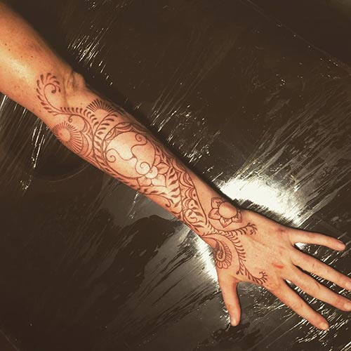 Henna-inspired hand tattoo design