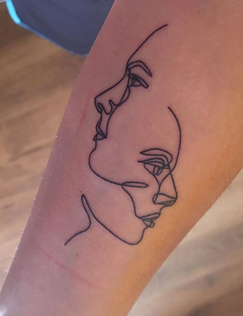 Two interlinked female artistic faces for the gemini tattoo