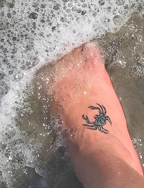 Cancer tattoo represented by a crab