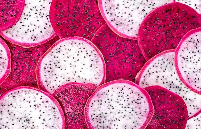 Close up of slices of dragon fruits with red and white flesh