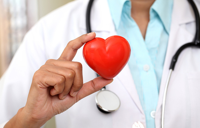 Doctor holds a heart shape to concur the cardiovascular benefits of saffron