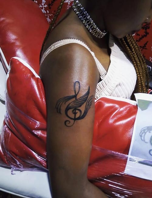 Musical tattoo design for women