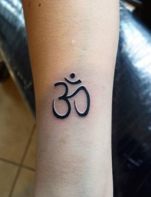 buddhist karma symbol tattoo