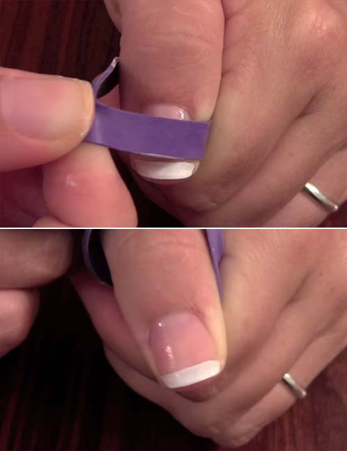 Pull off the rubber band to get the perfect French manicure of rubber band technique