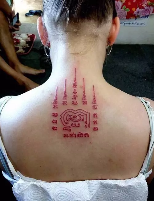 Thai tattoo on the upper back
