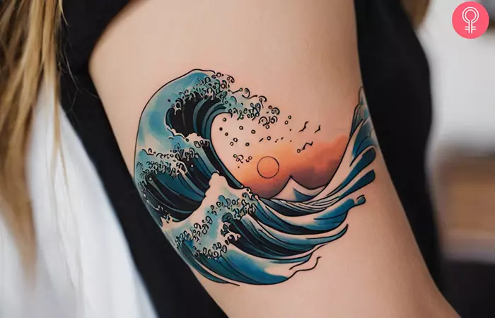 Wave tattoo on the arm of a woman