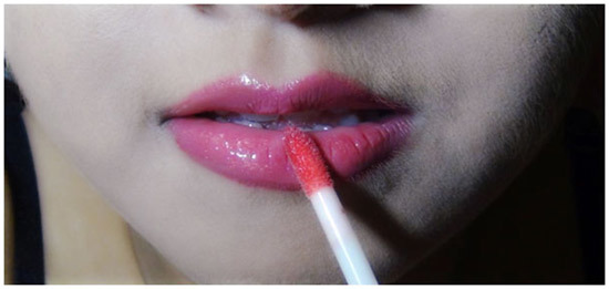 Apply lip gloss to make lips soft