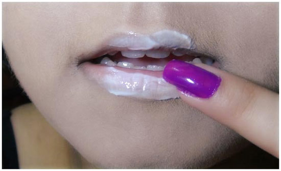 Use a heavy cream or lotion to massage to make lips soft