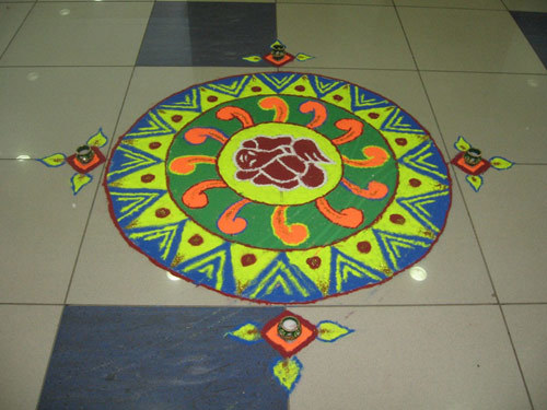 Small rangoli design with a Ganesha in the middle