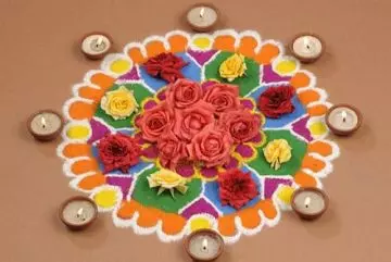 Small rangoli design with Diyas and roses