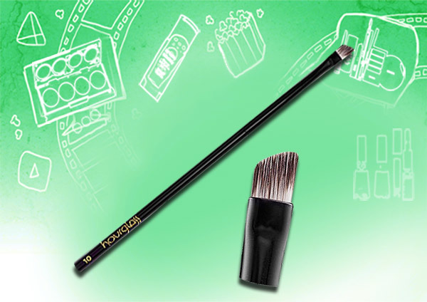 Flat angled eyeliner brush is used to draw slant lines