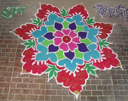 Rangoli design with floral pattern and shapes