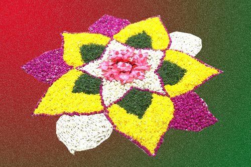 Flower petal rangoli design with center lotus flowers