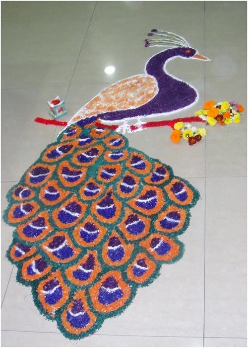 A full bodied peacock in shades of orange and blue for rangoli design
