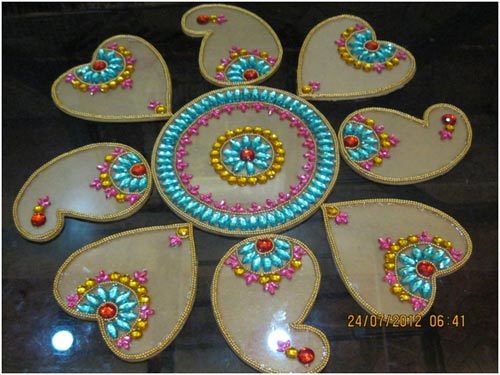 Simple rangoli design for competition with stones and beads