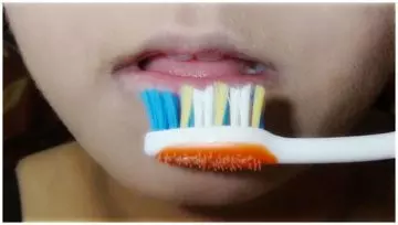 Exfoliate lips with a used toothbrush to make lips soft