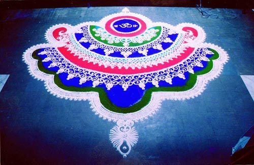 Beautiful rangoli design with 'OM' at center