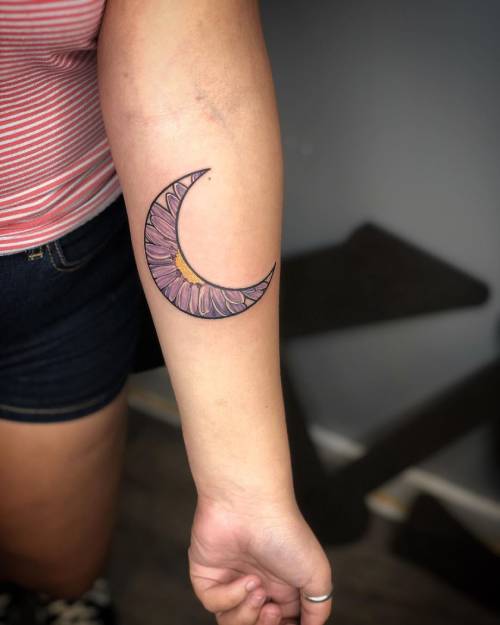 Simple crescent moon tattoo on sleeve