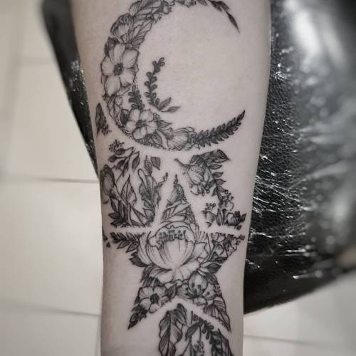Floral star and moon tattoo